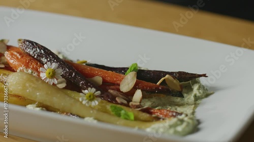 Wallpaper Mural Chef plates colorful carrots with herbs and edible flowers. Torontodigital.ca