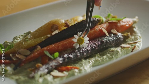 Wallpaper Mural Roasted rainbow carrots garnished with fresh herbs and an edible flower. Torontodigital.ca