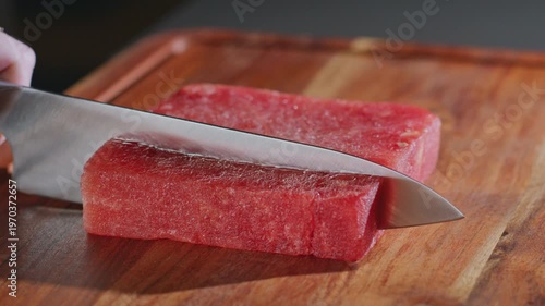 Wallpaper Mural Chef slices watermelon on a wooden cutting board. Torontodigital.ca