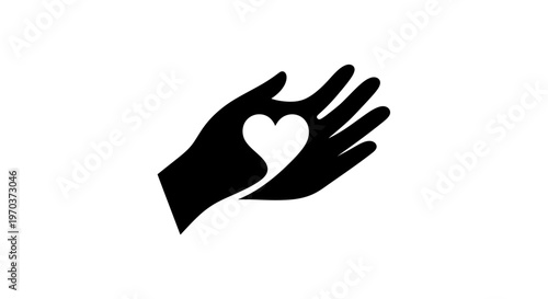 Hand holding a heart symbol.