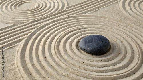 Top view raked sand garden creates symmetrical circular wave patterns surrounding smooth dark pebble presenting minimalist japanese aesthetic meditative atmosphere tranquil landscape design.
