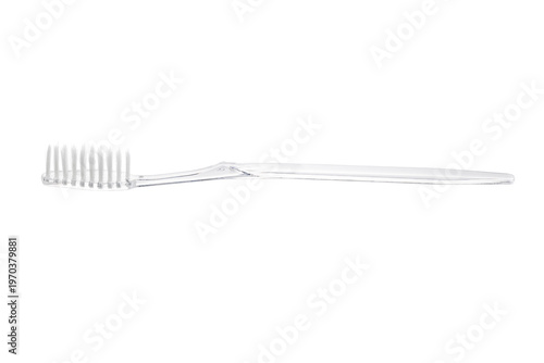 Transparent plastic toothbrush isolated on white background. Close-up