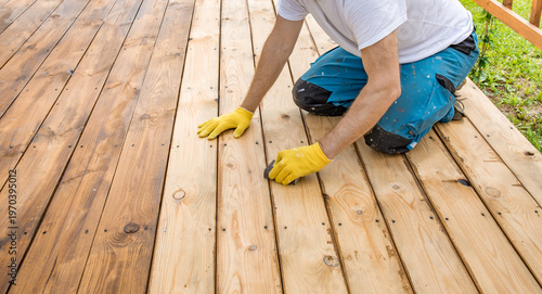 Wallpaper Mural Worker crouches on wooden deck Torontodigital.ca