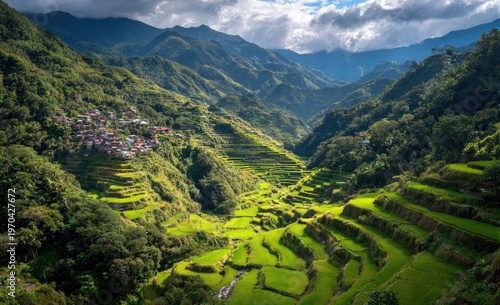 Lush green rice terraces carved into mountains, with a village