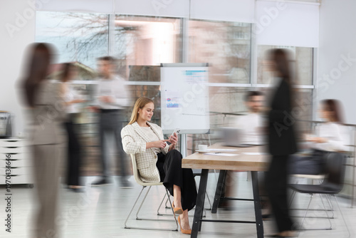 Canvas-taulu Colleagues working indoors, motion blur effect