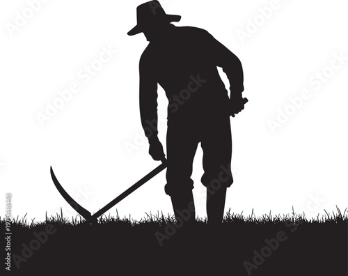 Silhouette of a farmer with a scythe working in a grassy field