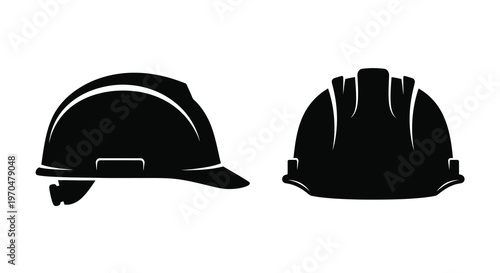 Two black construction helmets displayed as a striking graphic silhouette
