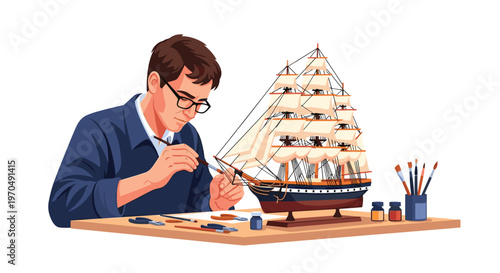 A dedicated craftsman wearing glasses carefully applies paint to a complex wooden model ship with white sails on a tidy workbench with various art tools.