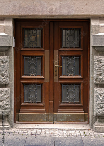 Closed vintage entrance door outside on city street