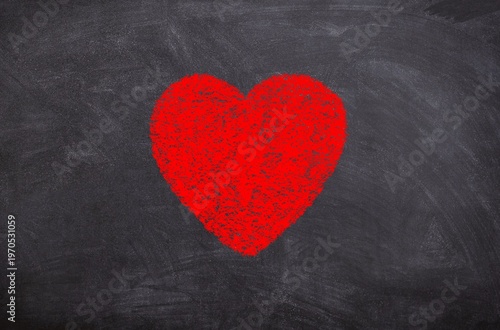 Hand drawn chalk sketch on blackboard red heart symbolizing love compassion care and emotions
