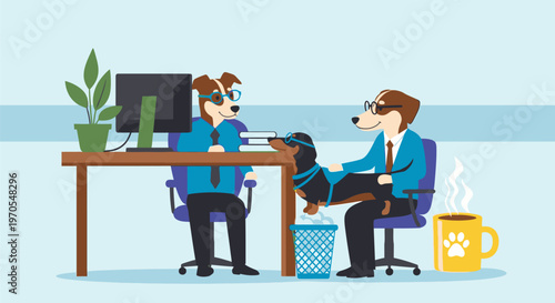 Two coworkers sit at a desk in an office discussing documents