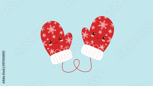 Pair of cozy red winter mittens decorated with white snowflake patterns and featuring sweet smiling faces.