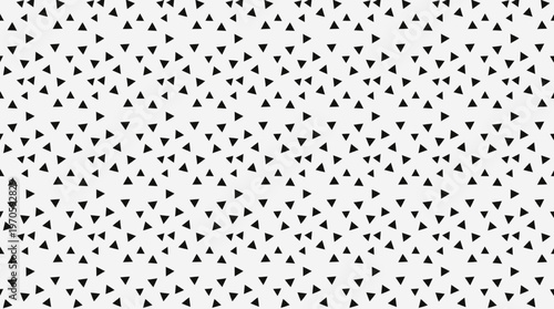 Seamless scattered black triangle geometric pattern background.