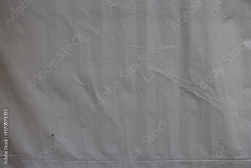 High resolution texture of creased wrinkled grey cloth fabric background