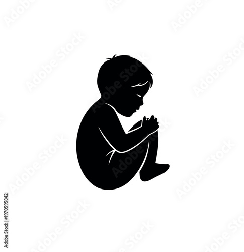 Silhouette of a baby in a fetal position.