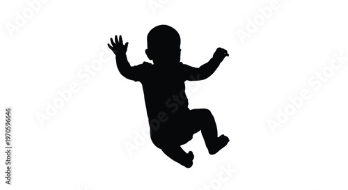 Dark silhouette of a playful infant baby with raised arms, possibly falling or floating cheerfully.