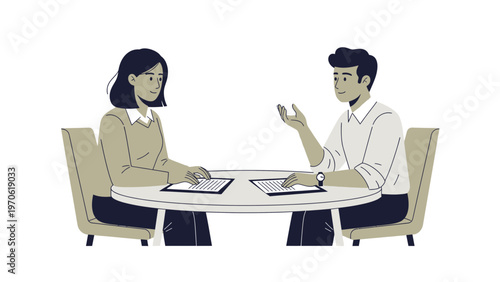 Business Meeting: Two People Discussing Documents at a Round Table