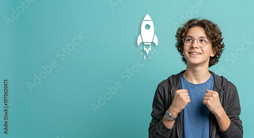 Young man with curly hair smiling.