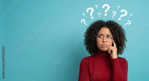 Woman with question marks thinking face.