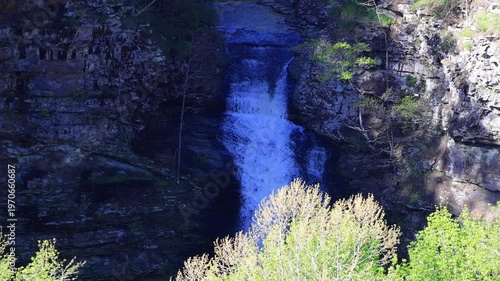 Wallpaper Mural Waterfall cascading down rocky cliff face. Torontodigital.ca