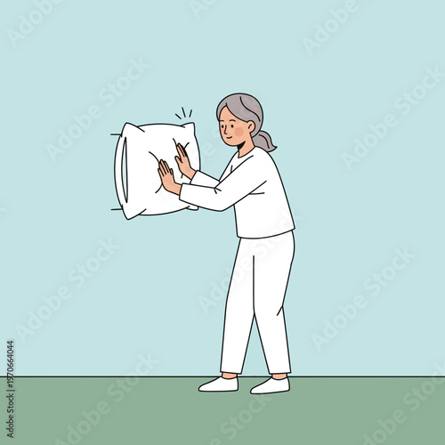 Woman Pushing Pillow Against Blue Wall With Hands Minimalist Style