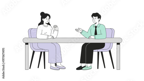 Two people sitting at a table, discussing business or having a meeting.