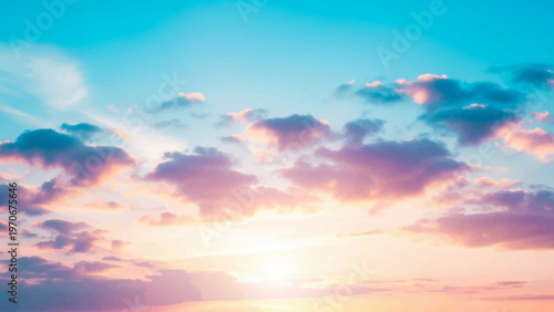 A vibrant and colorful sunset with fluffy clouds and a bright sun