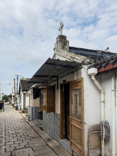 Cross on roof at Qingxi Ancient Town in Fengxian district, Shanghai, China, with history of more than 1400 years and charm of Jiangnan water town.