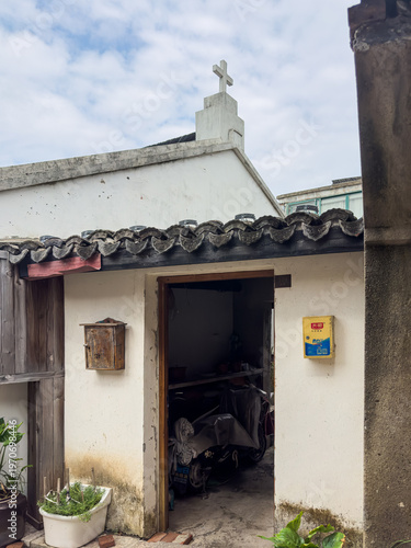 Cross on roof at Qingxi Ancient Town in Fengxian district, Shanghai, China, with history of more than 1400 years and charm of Jiangnan water town.