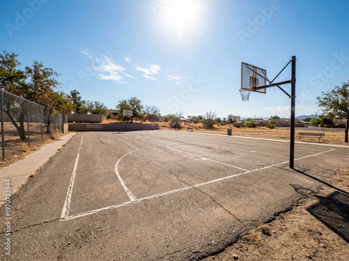 An inviting outdoor basketball court bathed in sunlight, a symbol of sport and recreation.