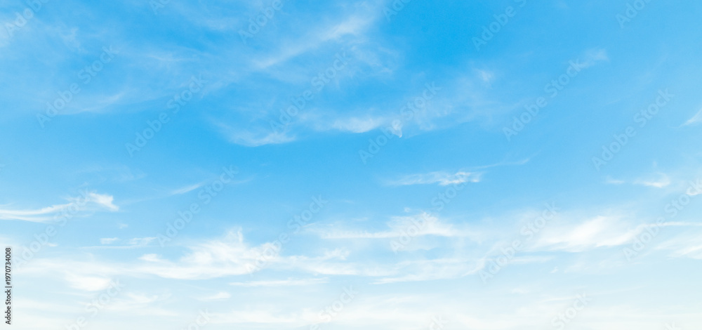 Fototapeta premium the sky is clear blue with fluffy white clouds, the sky is very bright, and the sun shines.