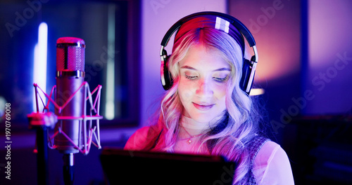 Fotografie Woman, neon and broadcaster with mic on tablet for radio podcast or recording in production studio