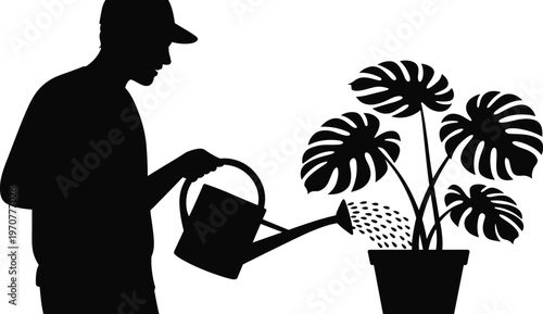 Business in black suit pointing at blooming purple flower in pot business suit white shirt black tie