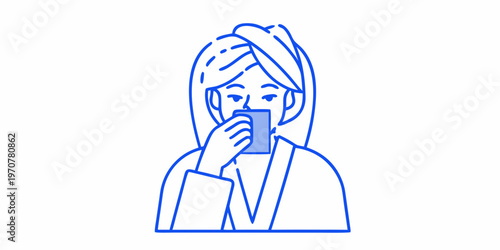 Woman in a robe applying skincare enjoying a morning routine