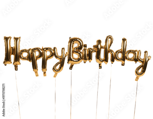 Golden foil balloon letters spelling out Happy Birthday are supported by thin sticks against a dark black background for a celebration.