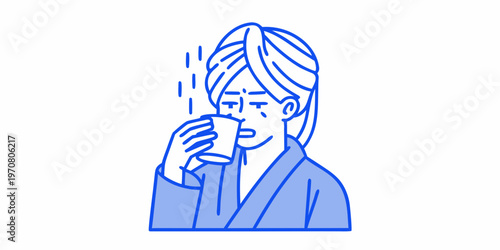 Woman enjoying a warm drink while relaxing with a towel wrapped head