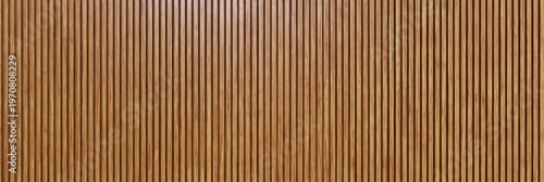 Vertical wooden slats arranged closely in a repeating pattern create a textured wall or partition with warm tones and natural grain.
