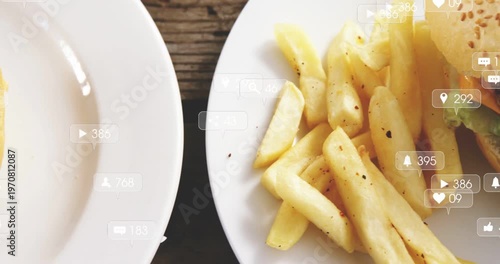 Social overlays appearing over burger and fries, camera panning left, counters rising showing likes