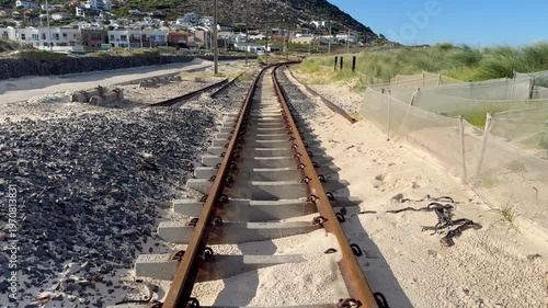 Train tracks at Glencairn Beach near Cape Town, South Africa.