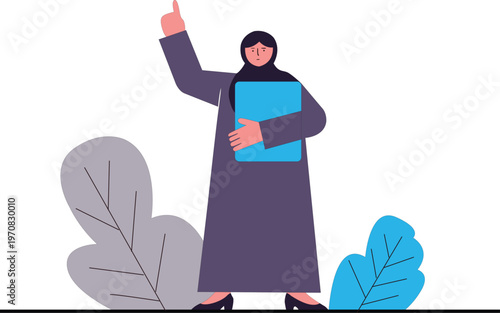 Woman in hijab holding blue book pointing up with right hand standing with leaves
