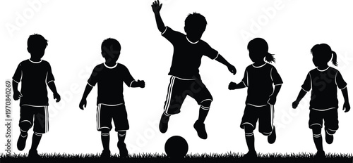 Group of children silhouettes playing soccer on grass field for youth sports competition, active childhood lifestyle, and physical education concepts.