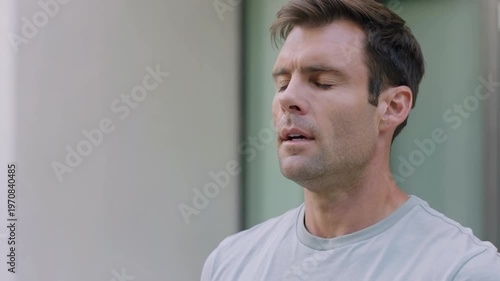 Stressed Man Breathing Deep, Feeling Relief and Smiling at Camera.