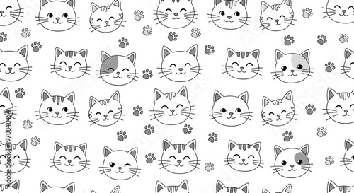 Seamless monochrome pattern of cute cartoon cat faces and small paw prints for wallpaper or textile designs.