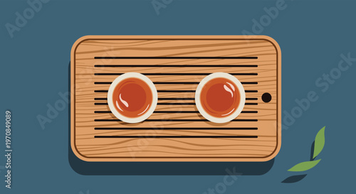 Two small cups of traditional hot herbal tea served on a wooden slatted tray seen from a top down perspective.