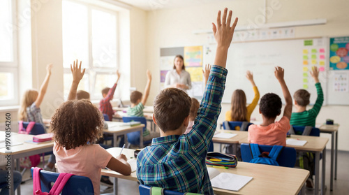 Bright classroom with students raising hands and teacher engaging young learners in school lesson
