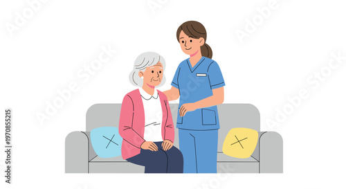 A smiling nurse in blue scrubs stands beside a smiling elderly woman with grey, wavy hair, who is seated on a grey sofa with blue and yellow cushions.