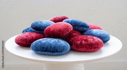 Red and Blue Velvet Cushion Macarons on White Display Pedestal