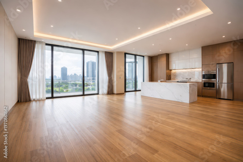 Modern interior of a spacious apartment with large windows and wooden flooring.