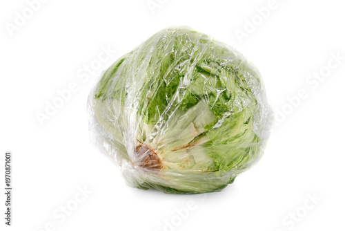 Fresh Whole Iceberg Lettuce Head wrapped in foil, isolated on white background