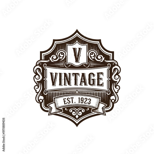 Vintage shield badge with ornate crest and lettering reading VINTAGE EST. 1923 emblem design.